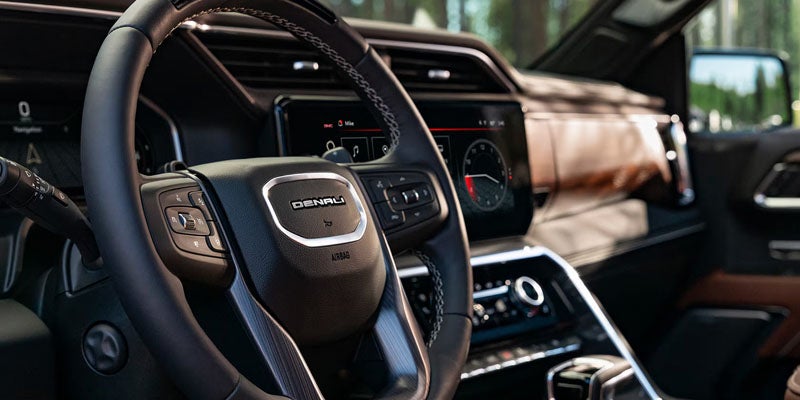 GMC Sierra highlighting sterring wheel and cockpit
